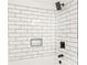 White subway tile shower with black fixtures and niche at 6920 Wyndbend Ln, Mint Hill, NC 28227