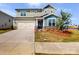 Two-story house with a two-car garage and landscaped front yard at 9912 Manor Vista Trl, Kannapolis, NC 28027