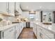 Modern kitchen with white cabinets, a large island, and stainless steel appliances at 9912 Manor Vista Trl, Kannapolis, NC 28027