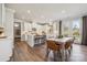 Modern kitchen with white cabinets, island, and stainless steel appliances at 9912 Manor Vista Trl, Kannapolis, NC 28027