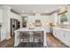 Bright kitchen with white cabinets, farmhouse sink, and stainless steel appliances at 9912 Manor Vista Trl, Kannapolis, NC 28027