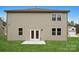 Exterior of home with well-manicured yard and white framed double doors at 9913 Manor Vista Trl, Kannapolis, NC 28027