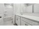 All white bathroom featuring shower/tub combination, white vanity, and tile flooring at 9913 Manor Vista Trl, Kannapolis, NC 28027