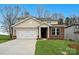 Charming two-story home with a two-car garage, brick facade, and well-manicured lawn at 9913 Manor Vista Trl, Kannapolis, NC 28027