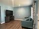 Cozy living room with modern furnishings and ample natural light at 102 Elm St # 94, New London, NC 28127