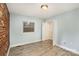 Spacious bedroom with a large closet and a brick accent wall at 1201 Green Oaks Ln # G, Charlotte, NC 28205