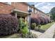 Brick building exterior with landscaping and walkway at 1201 Green Oaks Ln # G, Charlotte, NC 28205