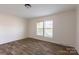 Spacious bedroom with neutral walls and wood-look flooring at 1520 Yellowstone Ct, Gastonia, NC 28054