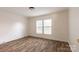 Bright bedroom with laminate flooring and two large windows at 1520 Yellowstone Ct, Gastonia, NC 28054