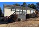 House exterior featuring a deck and well-maintained lawn at 1520 Yellowstone Ct, Gastonia, NC 28054