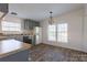 Eat-in kitchen with gray cabinets and laminate flooring at 1520 Yellowstone Ct, Gastonia, NC 28054