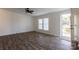 Living room with hardwood floors, door to deck and ceiling fan at 1520 Yellowstone Ct, Gastonia, NC 28054