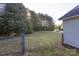 Side yard with chain link fence and trees at 1520 Yellowstone Ct, Gastonia, NC 28054