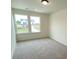 Bright bedroom featuring neutral carpeting and large windows at 3018 Cunningham Farm Dr, Indian Trail, NC 28079