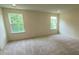 Spacious bedroom with neutral carpeting and large windows at 3018 Cunningham Farm Dr, Indian Trail, NC 28079