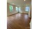 Large bonus room with carpeted floors and multiple windows at 3018 Cunningham Farm Dr, Indian Trail, NC 28079