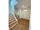 Light-filled entryway with hardwood floors and staircase at 3018 Cunningham Farm Dr, Indian Trail, NC 28079