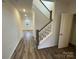 Bright entryway featuring hardwood floors and a classic staircase design at 3018 Cunningham Farm Dr, Indian Trail, NC 28079