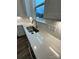 Kitchen with white quartz countertops and a stainless steel sink under a window at 3018 Cunningham Farm Dr, Indian Trail, NC 28079