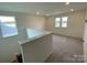 Spacious loft area with carpeted floors and natural light at 3018 Cunningham Farm Dr, Indian Trail, NC 28079