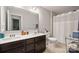 Bathroom featuring a double sink vanity, tile floors, a toilet, and a shower with a curtain at 3020 Pinehills Way, Mount Holly, NC 28120