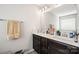 Bathroom featuring a double sink vanity with a large mirror and tile floors at 3020 Pinehills Way, Mount Holly, NC 28120