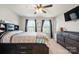 Bright bedroom featuring carpet floors, a ceiling fan, a dresser, and neutral paint at 3020 Pinehills Way, Mount Holly, NC 28120