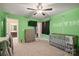 bedroom featuring green walls, a ceiling fan, a TV, and a closet at 3020 Pinehills Way, Mount Holly, NC 28120