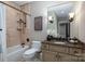 Elegant bathroom with a soaking tub, granite vanity, and updated fixtures at 520 E Martin Luther King Blvd # 1204, Charlotte, NC 28202