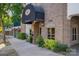 The Madison building entrance with brick facade and awning at 520 E Martin Luther King Blvd # 1204, Charlotte, NC 28202