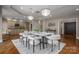 Bright dining room with hardwood floors and marble table at 520 E Martin Luther King Blvd # 1204, Charlotte, NC 28202