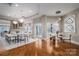 Elegant dining room with hardwood floors and a modern chandelier at 520 E Martin Luther King Blvd # 1204, Charlotte, NC 28202