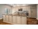 Island kitchen with granite countertops and custom cabinetry at 520 E Martin Luther King Blvd # 1204, Charlotte, NC 28202