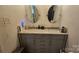 Double vanity bathroom with marble countertop and gray cabinets at 6001 Long Pine Dr, Charlotte, NC 28227