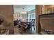 Bright dining area with a wooden table, bench seating, and chandelier at 6001 Long Pine Dr, Charlotte, NC 28227