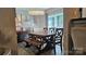 Rustic farmhouse dining set with a wooden bench and chandelier at 6001 Long Pine Dr, Charlotte, NC 28227