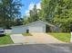 Gray sided home with a two-car garage and landscaped yard at 6001 Long Pine Dr, Charlotte, NC 28227