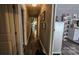 Long hallway with dark wood-look floors and access to multiple rooms at 6001 Long Pine Dr, Charlotte, NC 28227