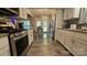 Modern kitchen with stainless steel appliances and light-colored cabinetry at 6001 Long Pine Dr, Charlotte, NC 28227