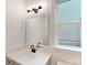 Bathroom with large vanity, dark faucet, and bright window at 10132 Whitaker Pointe Dr, Huntersville, NC 28078