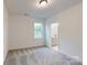 Bedroom with natural light, neutral carpet, and an ensuite bathroom at 10132 Whitaker Pointe Dr, Huntersville, NC 28078
