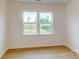 Bedroom with large windows and great view of nature at 10132 Whitaker Pointe Dr, Huntersville, NC 28078