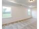 A bedroom with a view, tray ceiling, carpeted floors, and recessed lighting at 10132 Whitaker Pointe Dr, Huntersville, NC 28078