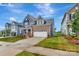New two story home with beautiful lawn and blue siding at 10132 Whitaker Pointe Dr, Huntersville, NC 28078