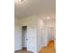 Hallway with closet on left leading to bathroom with door open at 10132 Whitaker Pointe Dr, Huntersville, NC 28078