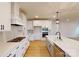 Gourmet kitchen featuring stainless steel appliances, a spacious island, modern lighting, and ample counter space at 10132 Whitaker Pointe Dr, Huntersville, NC 28078