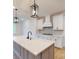Bright kitchen featuring a large island, stainless steel appliances, pendant lights, and white cabinetry at 10132 Whitaker Pointe Dr, Huntersville, NC 28078