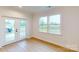 Bright room with natural light through french doors that lead to backyard at 10132 Whitaker Pointe Dr, Huntersville, NC 28078