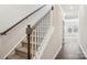 Elegant staircase with dark wood railing and carpeted steps at 1284 31St Ne St, Conover, NC 28613