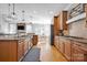 Spacious kitchen with wooden cabinets, granite countertops, and stainless steel appliances at 131 Lakeshore Hills Dr, Mooresville, NC 28117